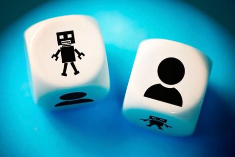 Two dice with human and AI symbols, photo montage