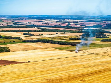 Scottish fields over Waterloo Monument from a drone, Jedburgh, Scotland, UK