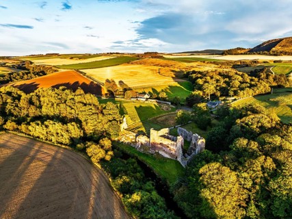 Ruins of Hailes Castle over River Tyne from a drone, East Linton, East Lothian, Scotland, UK