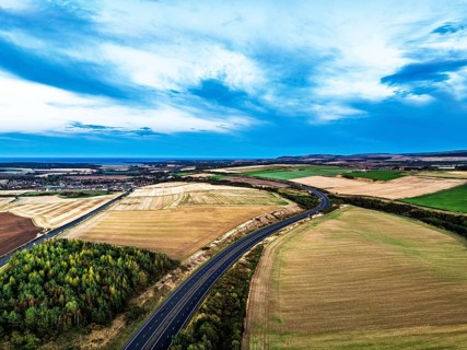 Sunset of Fields and Farms over Traprain Law and Hailes Castle from a drone, River Tyne,