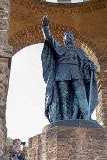 Woman photographed, statue, Kaiser Wilhelm Memorial, Porta Westfalica, North Rhine-Westphalia,