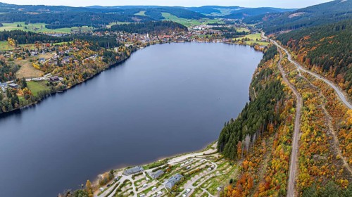 Titisee in the Black Forest around autumn. The landscape around the lake is in bright autumn colors