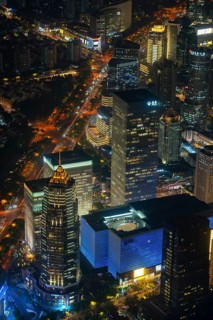 Aerial view over illuminated skyscrapers in Lujiazui financial district from Shanghai Tower