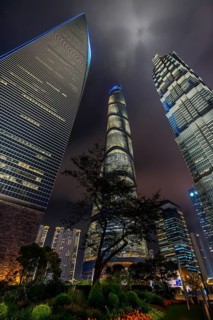Lujiazui financial district with illuminated skyscrapers, Shanghai Tower, SWFC and Jin Mao Tower in