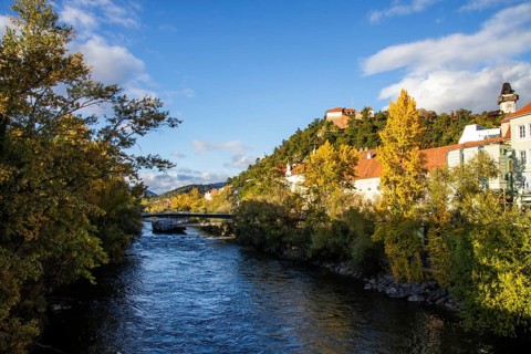 Murinsel, behind Schlossberg with clock tower, Graz, Styria, Austria