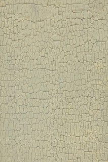 Abstract closeup surface view of old paint cracked on a wall, Suomusjärvi kirkonkylä, Finland