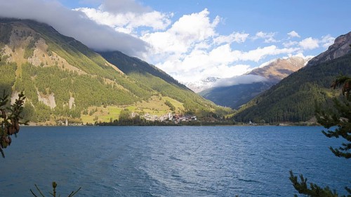 View over Lake Reschen to the village of Graun in Vinschgau, which is beautifully situated in the