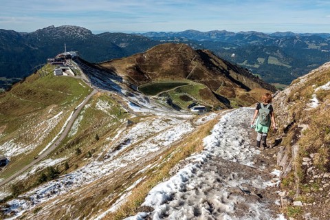 Female hiker on hiking trail below the Kanzelwand, back left Kanzelwandbahn mountain station,