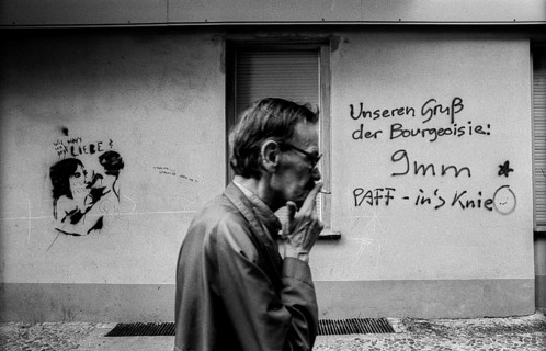 Germany, Berlin, 3.8.1992, graffiti in Prenzlauer Berg: Our greeting from the bourgeoisie 9 mm -