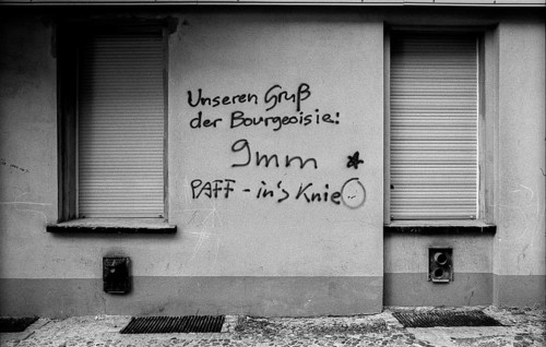 Germany, Berlin, 3.8.1992, graffiti in Prenzlauer Berg: Our greeting from the bourgeoisie 9 mm -