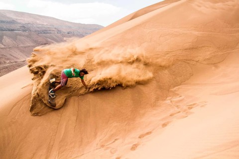 Sandboarding in Cerro Dragon, in Atacama Desert. Iquique, Tarapaca Region, Chile. 18.11.15