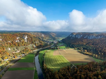 Aerial view of the autumn-colored Upper Danube Valley, Durchbruchtal, on the right the Hausener