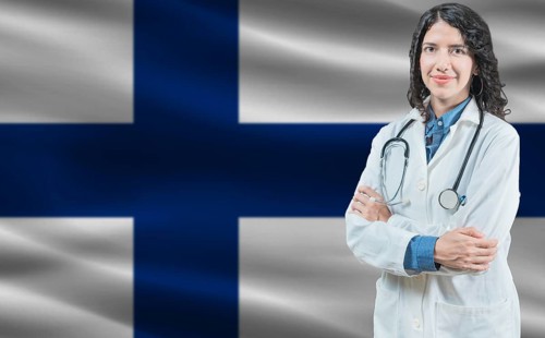 Finnish medicine and healthcare concept. Close up of doctor against Finland flag background