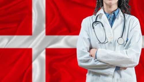 Medical professional on Denmark flag. Healthcare and wellness in Denmark, Concept