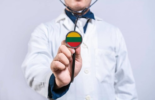 Doctor hands holding stethoscope with Lithuania flag. Lithuania health and care concept