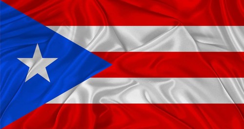 Flag of Puerto Rico with cloth texture. Close up of Puerto Rico flag waving