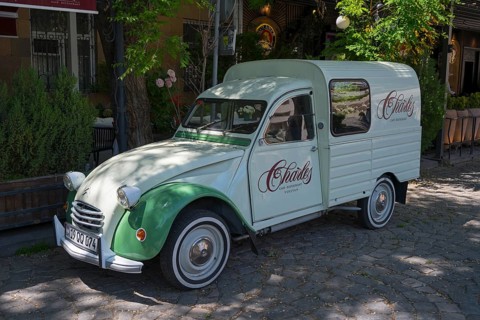 Retro-colored Citroen car parked in shady area under trees, Citroen 2CV, Citroën, vintage car,