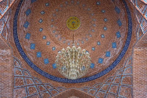 Magnificent dome with geometric patterns and central chandelier in a mosque, Blue Mosque, Shiite