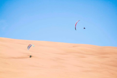 Paragliding at Atacama Desert. Iquique, Tarapaca Region, Chile