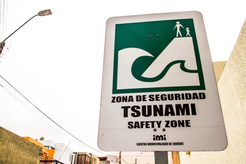 Sign indicating safe zone in case of tsunami. Iquique, Tarapaca Region, Chile. 16.11.15