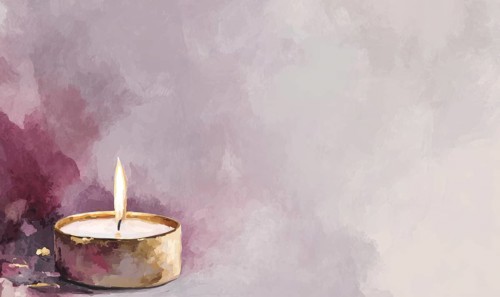 A small candle is lit in a gold-colored holder, creating a warm and inviting atmosphere. The
