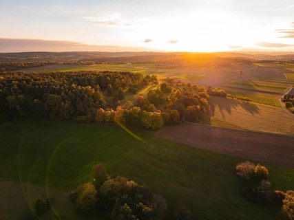Aerial view of peaceful autumn landscape with sunset in the background, Venusberg, Aidlingen,