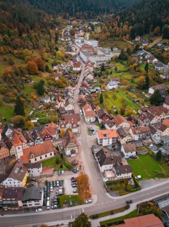 Aerial view of a city scene in a wooded mountain landscape with autumn colors, Calmbach, Bad