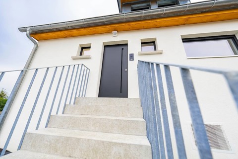 Front view of the entrance with clear lines and quiet, modern look, house renovation,