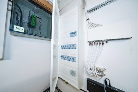 Open electrical distributor in bright technical room, house renovation, air conditioning