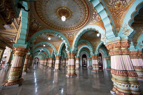 Granite columns with ornate arches and stucco ceilings, Durbar Hall in Mysuru Palace or Amba Vilas