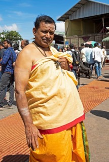 Hindu monk, 63 years old, in monk's robe, puja at the Chamundeswar Hindu temple on Chamundi Hill,