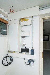 Network and communication distributor with patch panel, switch and properly routed cables, house