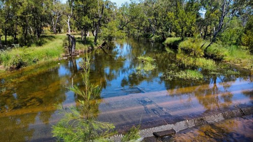 A flooded street at the end of the rainy season in the Northern Territory, Australia, photograped