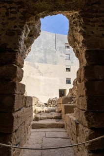 An old historic theatre in the middle of a town surrounded by houses. This landmark was