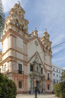 An old historic town. The Iglesia del Carmender church on the promenade shows its former glory of