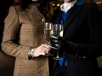 Members of the Toronto North York Hunt Club, dressed in traditional hunting clothes, enjoy a glass