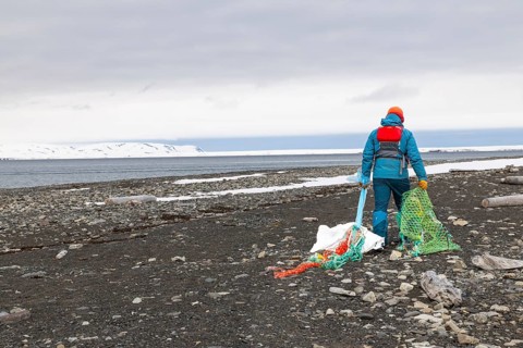 Collecting washed up fishing nets on the beach, sea, Mushamna, Spitsbergen, Svalbard