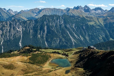 View from the Fellhorn Ridge hiking trail to Schlappoldsee and mountains of the Allgäu Alps,