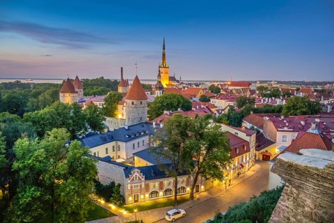 Evening city panorama, city towers, city walls, St. Olaf's Church in the back, view of the old