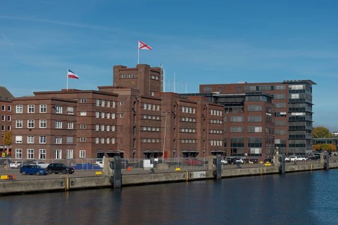 Former warehouse in the port of Kiel, apartments, services, red brick building, architecture, quay,