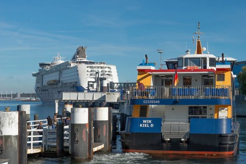Fjord liner docks, ferry and cruise ship Color Magic of the Norwegian Color Line, Kiel port, car