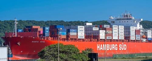 Container ship from the shipping company Hamburg Süd Santa Rita with container leaving Container