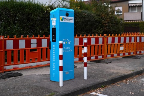 Parking lot with gas pump, EnBW charging station for electric cars, charging station, e-mobility,