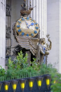 Angel figure with big clock at the upscale department store Selfridge, Oxford Street, London,