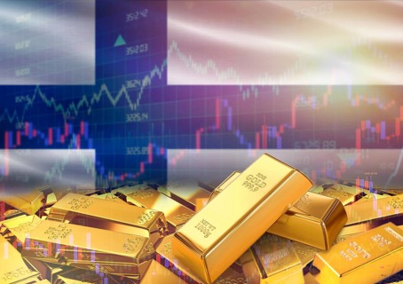 Gold bars on Finland flag in background. Gold bars stacked on Finnish flag. Concept of Finland gold