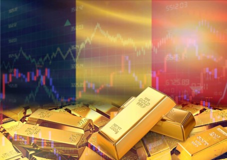 Gold bars on Belgium flag in background. Gold bars stacked on Belgian flag. Concept of Belgium gold