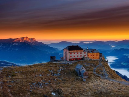 Watzmannhaus at sunrise, fog in the valley, Untersberg on the left in first sunlight, Berchtesgaden