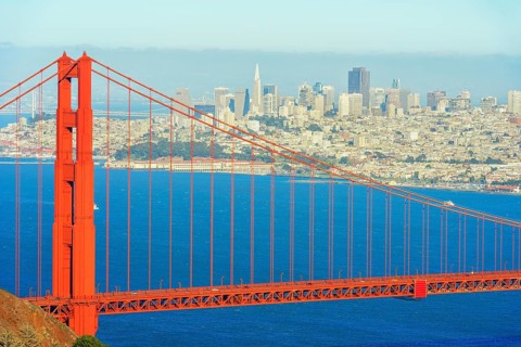 View of Golden Gate Bridge and financial district in the distance, San Francisco, California, USA