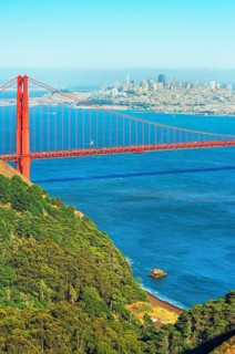 View of Golden Gate Bridge and financial district in the distance, San Francisco, California, USA