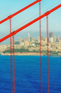 View of Golden Gate Bridge and financial district in the distance, San Francisco, California, USA